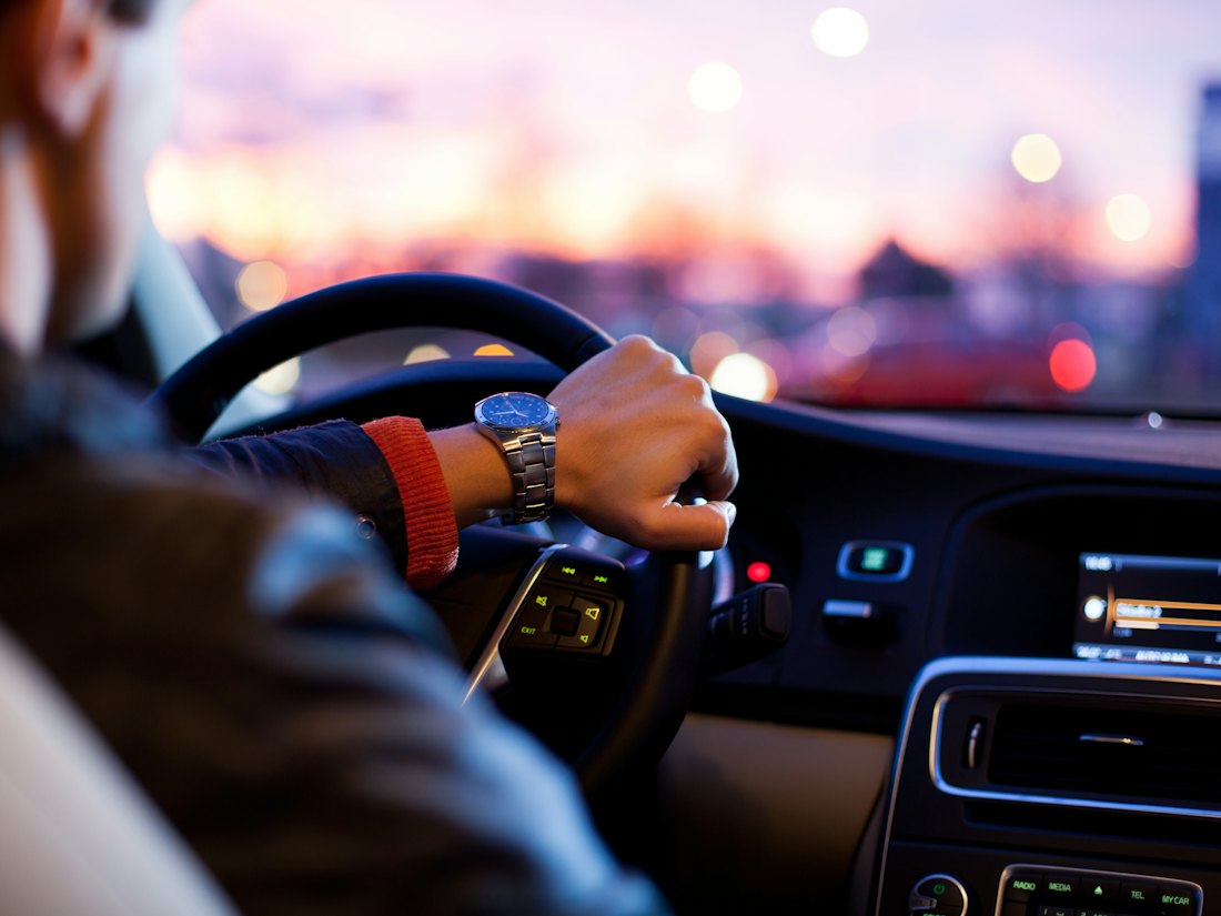 Driver's view at the wheel of a car on an early-morning commute